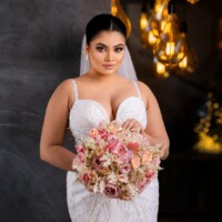 moody bridal portrait with rose bouquet